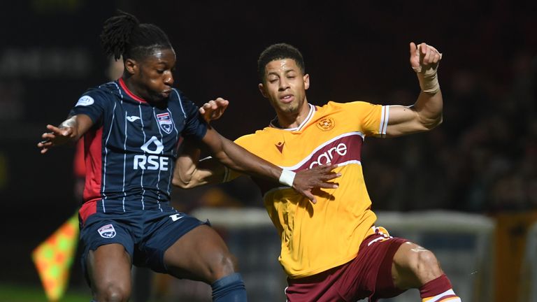 Ross County&#39;s Joseph Hungbo challenges Motherwell&#39;s Jake Carroll 
