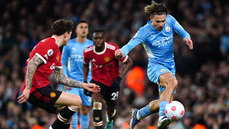 Manchester City&#39;s Jack Grealish (right) controls the ball
