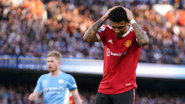 Jadon Sancho reacts to a missed chance for Manchester United against Manchester City as Kevin De Bruyne watches on
