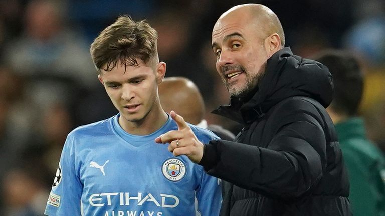 James McAtee receives instructions from Pep Guardiola
