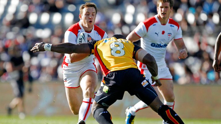 England's James Roby runs the ball at Papua New Guinea's Makali Aizue during a rugby league Four Nations tournament. (AP Photo/NZPA, Wayne Drought) 