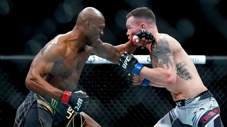 Kamaru Usman, left, exchanges punches with Colby Covington during a welterweight mixed martial arts championship bout at UFC 268, Sunday, Nov. 7, 2021, in New York. (AP Photo/Corey Sipkin)