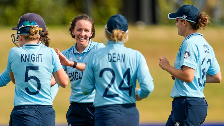 Kate Cross, centre, celebrates with England team-mates after another India wicket