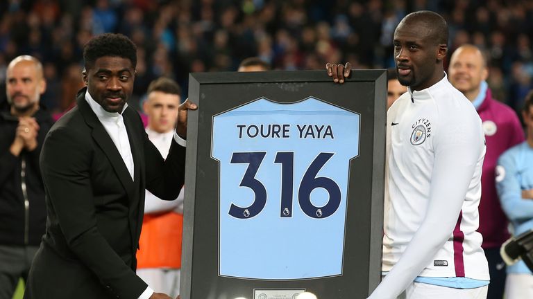 Manchester, United Kingdom - Kolo Toure presents his brother Yaya Toure of Manchester City with gift during the premier league match at the Etihad Stadium, Manchester. Picture date 9th May 2018. 