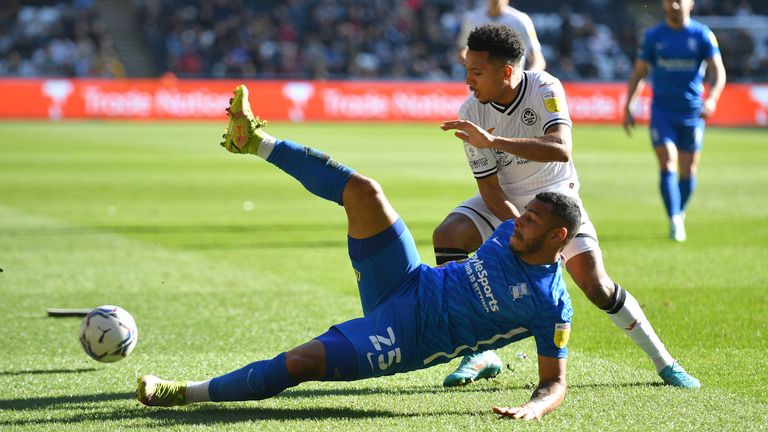 Swansea City's Korey Smith and Birmingham City's Onel Hernandez (left) battle for the ball