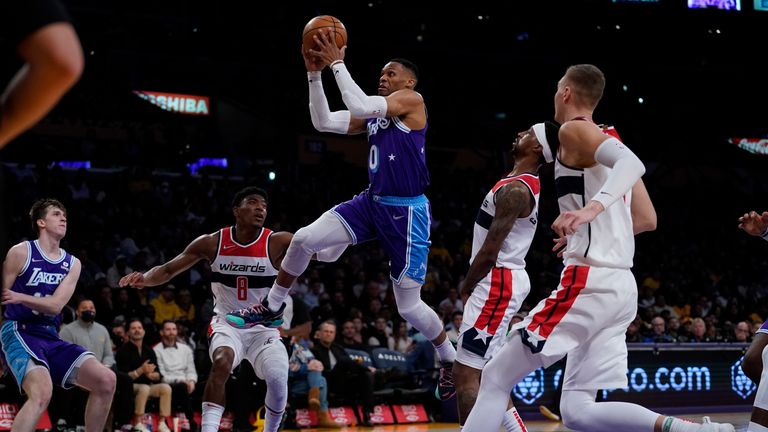 Los Angeles Lakers guard Russell Westbrook (0) shoots during the first half of an NBA basketball game against the Washington Wizards in Los Angeles, Friday, March 11, 2022.
