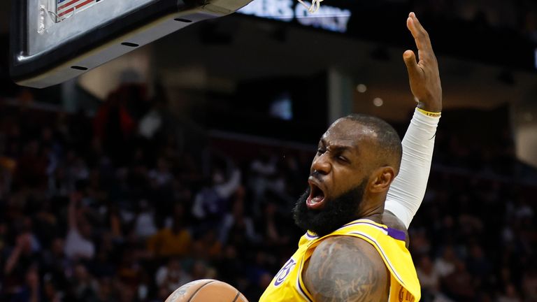 Los Angeles Lakers&#39; LeBron James dunks against the Cleveland Cavaliers during the second half of an NBA basketball game, Monday, March 21, 2022, in Cleveland.