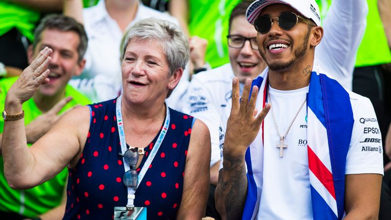  Hamilton celebrates with mother Carmen Larbalestier, now Lockhart, after winning his fourth F1 title in 2017