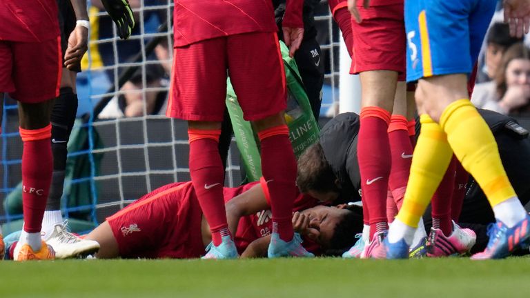 Luis Diaz receives treatment after scoring for Liverpool at Brighton