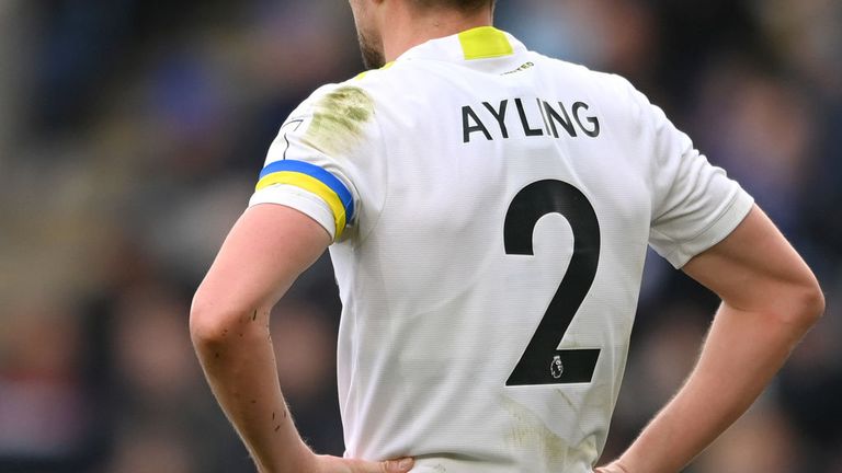 Luke Ayling wore a blue and yellow striped armband