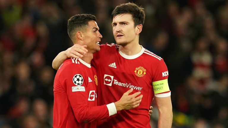 Manchester United's Cristiano Ronaldo, left, and Manchester United's Harry Maguire celebrate after the the Champions League Group F soccer match between Manchester United and Atalanta at Old Trafford, Manchester, England, Wednesday, Oct. 20, 2021.