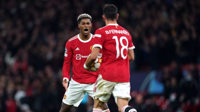 Manchester United's Marcus Rashford (left) celebrates scoring their side's first goal of the game with team-mate Bruno Fernandes during the UEFA Champions League, Group F match at Old Trafford, Manchester. Picture date: Wednesday October 20, 2021.