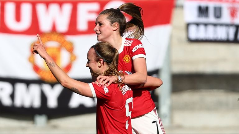 Martha Thomas of Manchester United celebrates with teammate Ella Toone after scoring their side's first goal during the Barclays FA Women's Super League match between Manchester United Women and Leicester City Women at Leigh Sports Village on March 05, 2022 in Leigh, England. (Photo by Clive Brunskill/Getty Images)