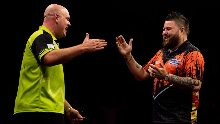 Michael Smith and Michael van Gerwen in the final of Round 5 of the Premier League in Brighton