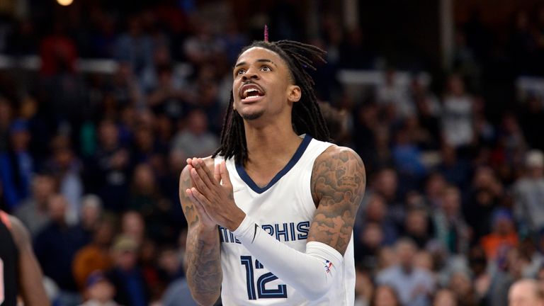 Memphis Grizzlies guard Ja Morant (12) reacts in the second half of an NBA basketball game against the New York Knicks Friday, March 11, 2022, in Memphis, Tenn.
