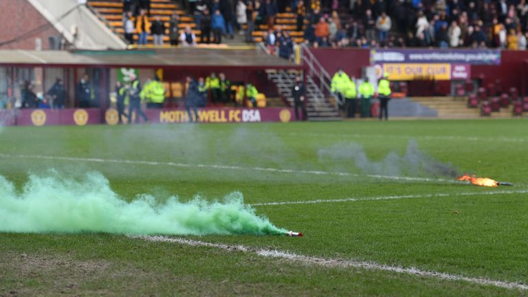 MOTHERWELL, SCOTLAND - MARCH 13: Flares on the pitch at full time during a Scottish Cup match between Motherwell and Hibernian at Fir Park, on March 13, 2022, in Motherwell, Scotland.  (Photo by Craig Foy / SNS Group)