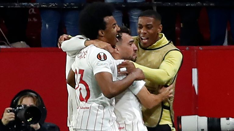 Sevilla's Munir El Haddadi celebrates with his team-mates after scoring against West Ham (AP)