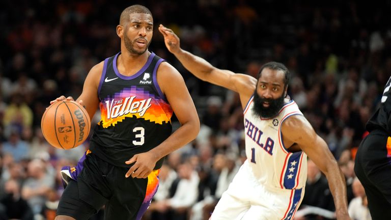 Phoenix Suns guard Chris Paul (3) drives by Philadelphia 76ers guard James Harden during the second half of an NBA basketball game, Sunday, March 27, 2022, in Phoenix. Phoenix won 114-104.