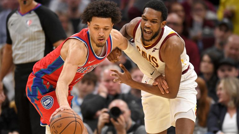 Detroit Pistons&#39; Cade Cunningham steals the ball from Cleveland Cavaliers&#39; Evan Mobley in the second half of an NBA basketball game, Saturday, March 19, 2022, in Cleveland.