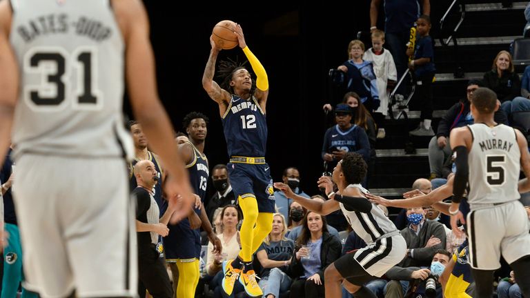 Memphis Grizzlies guard Ja Morant goes up for a shot at the buzzer at the end of the first half of the team&#39;s NBA basketball game against the San Antonio Spurs on Monday, Feb. 28, 2022, in Memphis, Tenn.