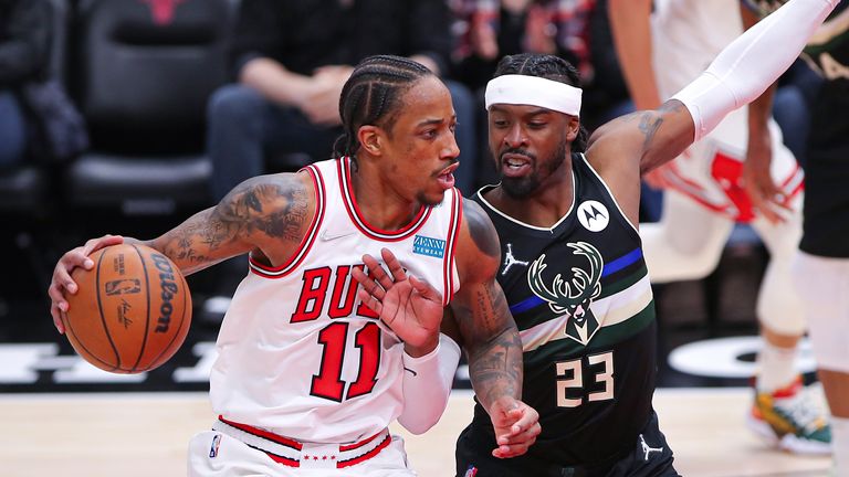 MARCH 04: Milwaukee Bucks guard Wesley Matthews (23) posts up against Chicago Bulls forward DeMar DeRozan (11) during a NBA game between the Milwaukee Bucks and the Chicago Bulls on March 4, 2022 at the United Center in Chicago, IL.