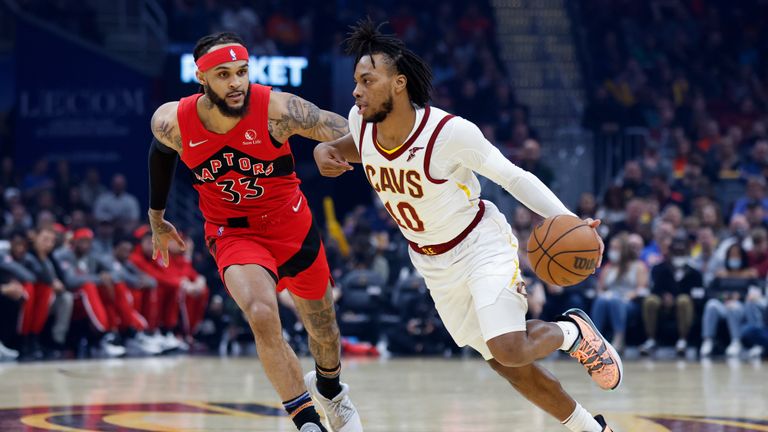 Cleveland Cavaliers&#39; Darius Garland (10) drives against Toronto Raptors&#39; Gary Trent Jr. (33) during the first half of an NBA basketball game, Sunday, March 6, 2022, in Cleveland. (AP Photo/Ron Schwane)



