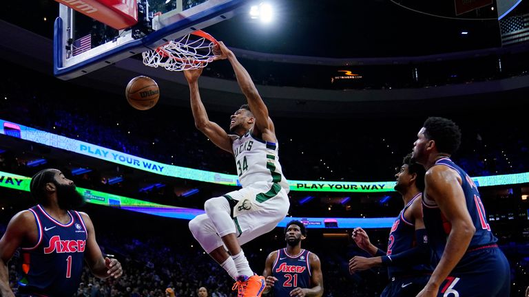 Milwaukee Bucks' Giannis Antetokounmpo dunks the ball during the first half of an NBA basketball game against the Philadelphia 76ers, Tuesday, March 29, 2022, in Philadelphia.