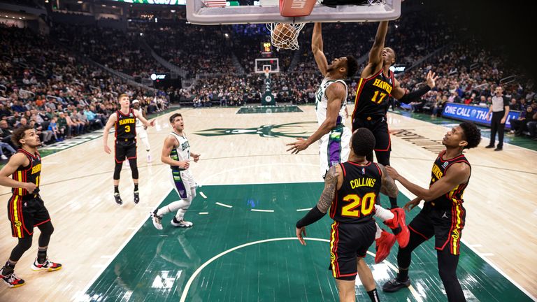 Milwaukee Bucks&#39; Giannis Antetokounmpo (34) dunks against Atlanta Hawks&#39; Onyeka Okongwu (17) during an NBA basketball game Wednesday, March 9, 2022, in Milwaukee.