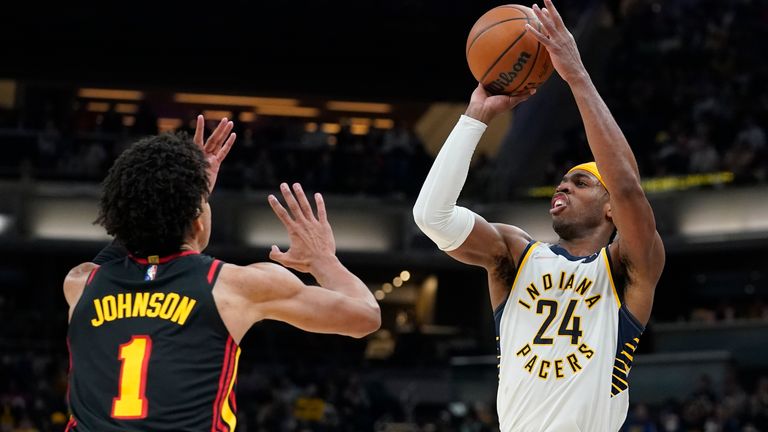 Indiana Pacers&#39; Buddy Hield shoots over Atlanta Hawks&#39; Jalen Johnson during the second half of an NBA basketball game, Monday, March 28, 2022, in Indianapolis.