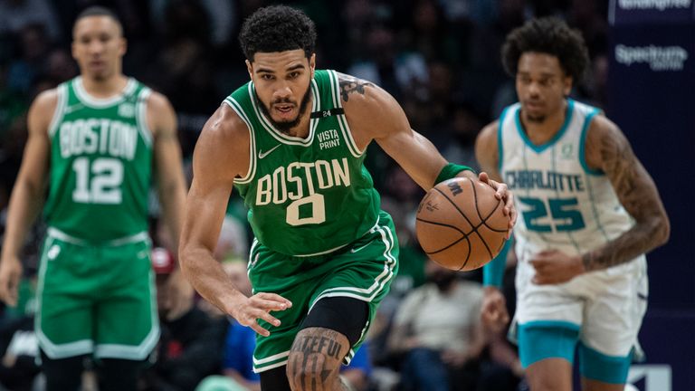 Boston Celtics forward Jayson Tatum (0) leads a fast break during the first half of the team&#39;s NBA basketball game against the Charlotte Hornets, Wednesday, March 9, 2022, in Charlotte, N.C.