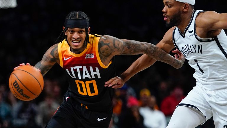 Utah Jazz&#39;s Jordan Clarkson (00) drives past Brooklyn Nets&#39; Bruce Brown (1) during the second half of an NBA basketball game Monday, March 21, 2022, in New York.