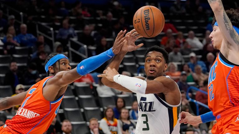 Oklahoma City Thunder guard Shai Gilgeous-Alexander, left, knocks the ball away fromUtah Jazz guard Trent Forrest (3) in the second half of an NBA basketball game Sunday, March 6, 2022, in Oklahoma City. (AP Photo/Sue Ogrocki)


