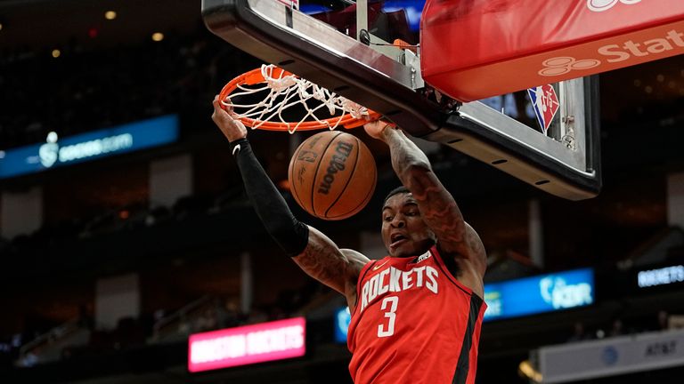 Houston Rockets&#39; Kevin Porter Jr. dunks the ball against the Phoenix Suns during the first half of an NBA basketball game Wednesday, March 16, 2022, in Houston. (AP Photo/David J. Phillip)