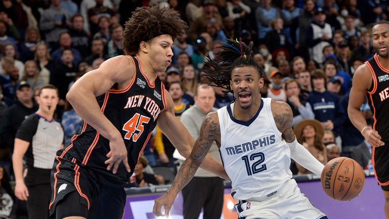 Memphis Grizzlies guard Ja Morant (12) drives against New York Knicks forward Jericho Sims (45) during the second half of an NBA basketball game Friday, March 11, 2022, in Memphis, Tenn