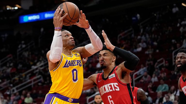 Los Angeles Lakers&#39; Russell Westbrook (0) goes up for a shot as Houston Rockets&#39; KJ Martin Jr. (6) defends during the first half of an NBA basketball game Wednesday, March 9, 2022, in Houston.