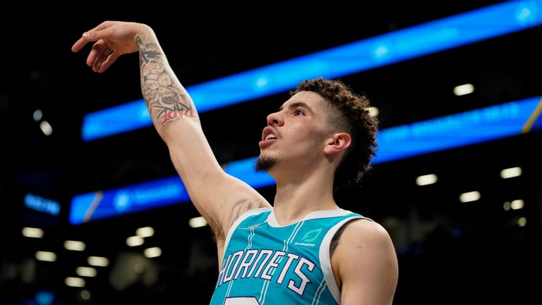 Charlotte Hornets guard LaMelo Ball (2) watches his three-point shot in the first half of an NBA basketball game against the Brooklyn Nets, Sunday, March 27, 2022, in New York.