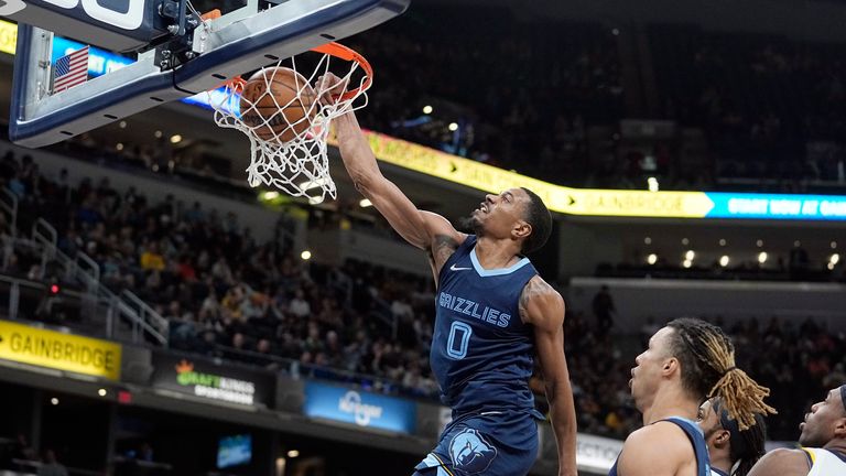 Memphis Grizzlies' De'Anthony Melton dunks during the second half of an NBA basketball game against the Indiana Pacers.