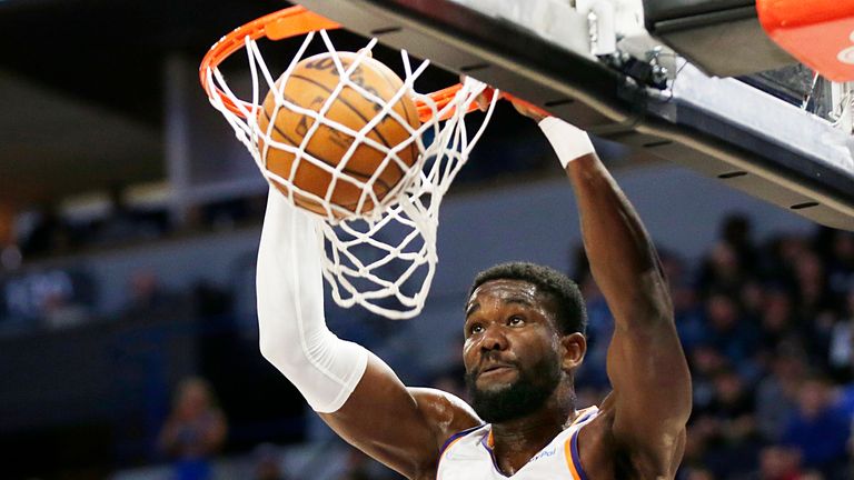 Phoenix Suns center Deandre Ayton dunks against the Minnesota Timberwolves during the second half of an NBA basketball game Wednesday, March 23, 2022, in Minneapolis. 