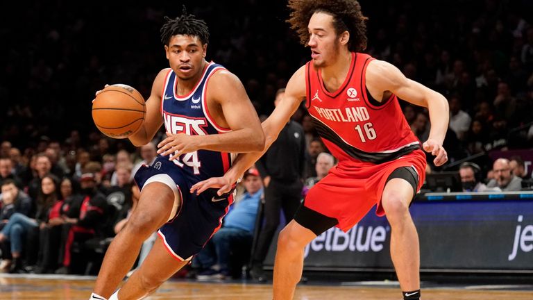 Brooklyn Nets guard Cam Thomas (24) drives against Portland Trail Blazers guard CJ Elleby (16) in the second half of an NBA basketball game, Friday, March 18, 2022, in New York. (AP Photo/John Minchillo)


