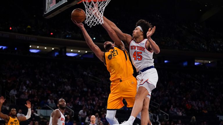 New York Knicks&#39; Jericho Sims challenges Utah Jazz&#39;s Rudy Gobert as he goes to the basket 