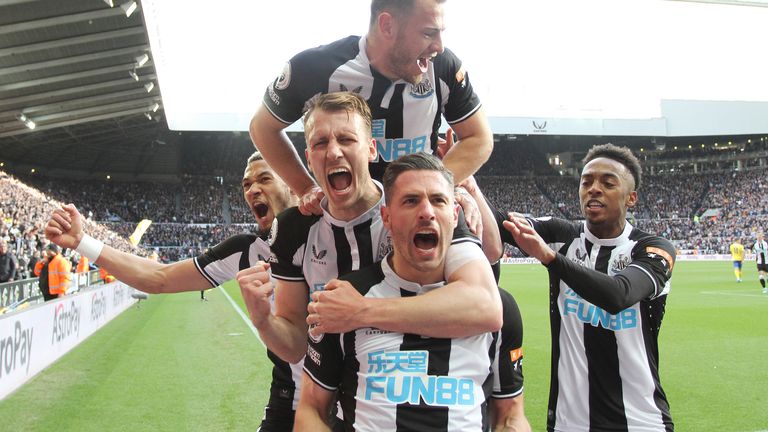 Newcastle players celebrate their second goal
