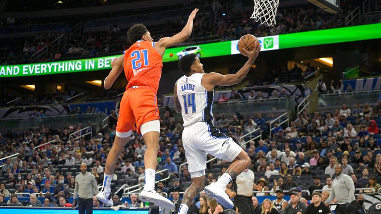Orlando Magic guard Gary Harris goes up for a shot in front of Oklahoma City Thunder guard Aaron Wiggins 