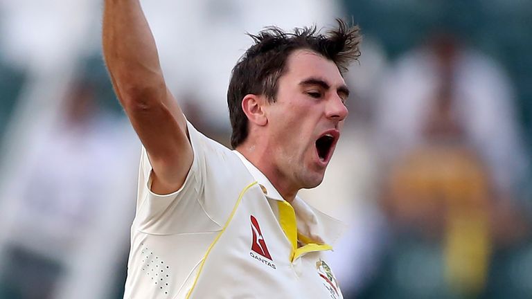 Australia&#39;s Pat Cummins celebrates after taking the wicket of Pakistan&#39;s Nauman Ali on the third day of the third test match between Pakistan and Australia at the Gaddafi Stadium in Lahore, Pakistan, Wednesday, March 23, 2022. (AP Photo/K.M. Chaudary).
