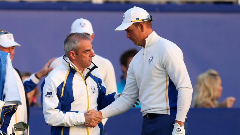 Europea captain Paul McGinley (centre) shakes hands with Henrik Stenson (right) on the first tee during day two of the 40th Ryder Cup at Gleneagles Golf Course, Perthshire.