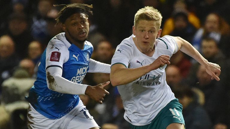 Peterborough&#39;s Ricky-Jade Jones and Man City&#39;s Oleksandr Zinchenko vie for the ball