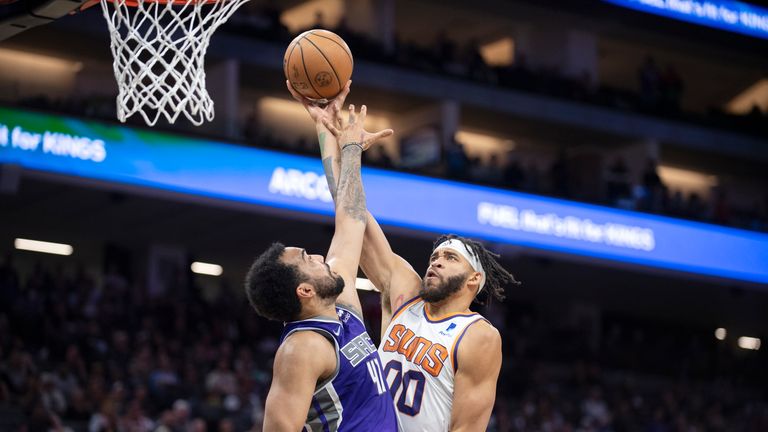 Phoenix Suns center JaVale McGee shoots and scores over Sacramento Kings forward Trey Lyles 