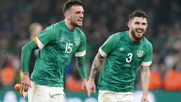 Troy Parrott (left) celebrates his late winner for the Republic of Ireland