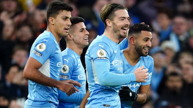 Manchester City&#39;s Riyad Mahrez celebrates with team-mates coring their side&#39;s third goal of the game