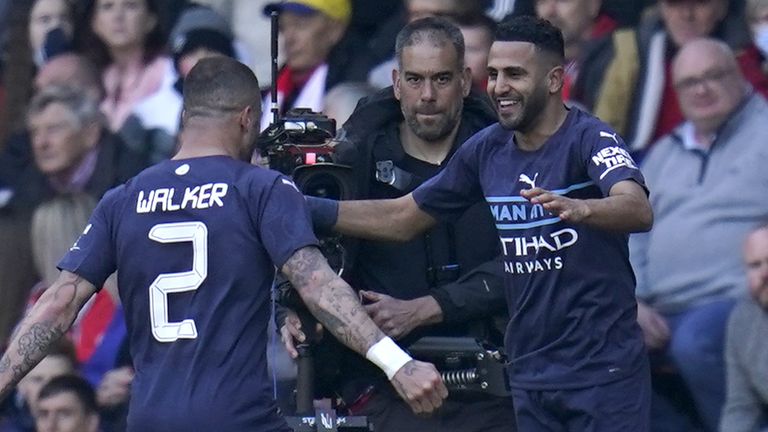 Manchester City's Riyad Mahrez (right) celebrates scoring their side's fourth goal of the game