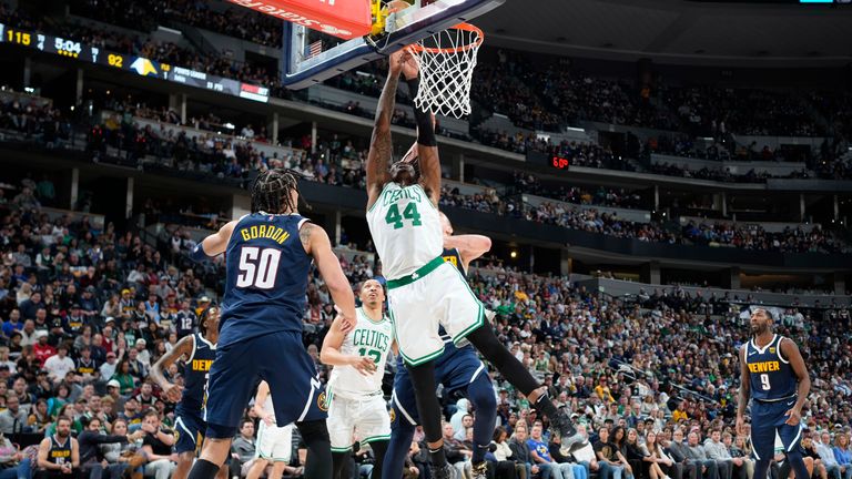 Boston Celtics center Robert Williams III drives to the rim as Denver Nuggets forward Aaron Gordon defends